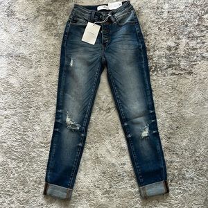 Women’s KanCan Jeans. New with tags, size 0/23, button fly mildly distressed